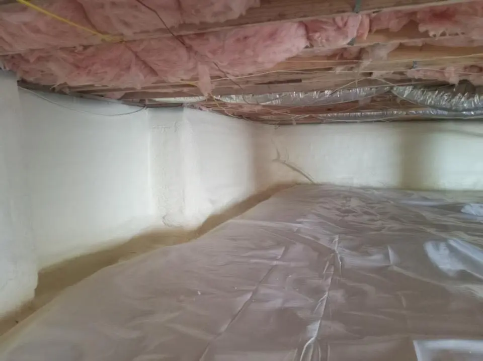 Crawl space encapsulation with closed-cell spray foam for Commercial Roof Restoration in Grand Ledge
